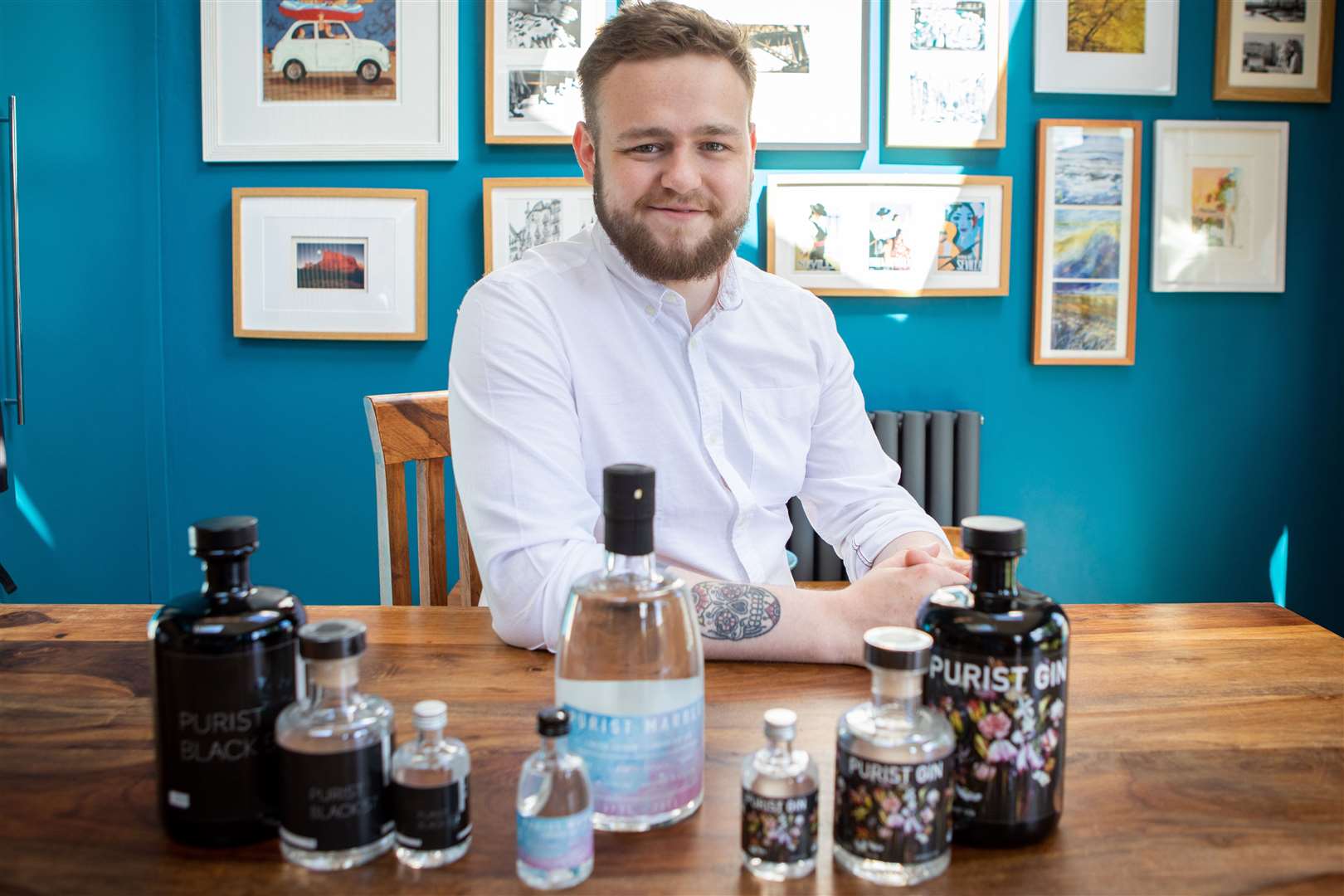 Bruce Walker with a selection of his gins (Elaine Livingstone/PA)