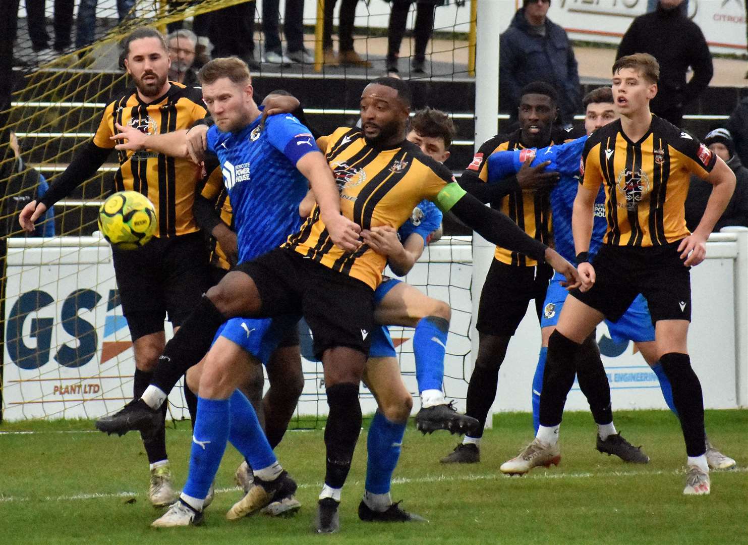 Dartford's Josh Hill in the thick of the action against Folkestone earlier this season. Picture: Randolph File