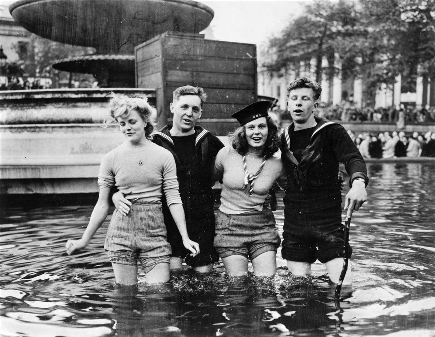 Joyce Digney and Cynthia Covello were famously photographed celebrating VE Day with two sailors in a fountain in Trafalgar Square (Imperial War Museum/PA)