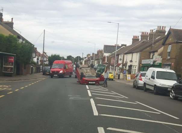 The car has flipped on London Road. Credit: @dancafc80