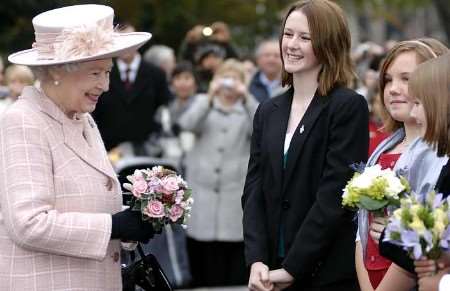 CLOSE ENCOUNTER: youngsters meeting the Queen on her arrival. Pictures: MATTHEW READING