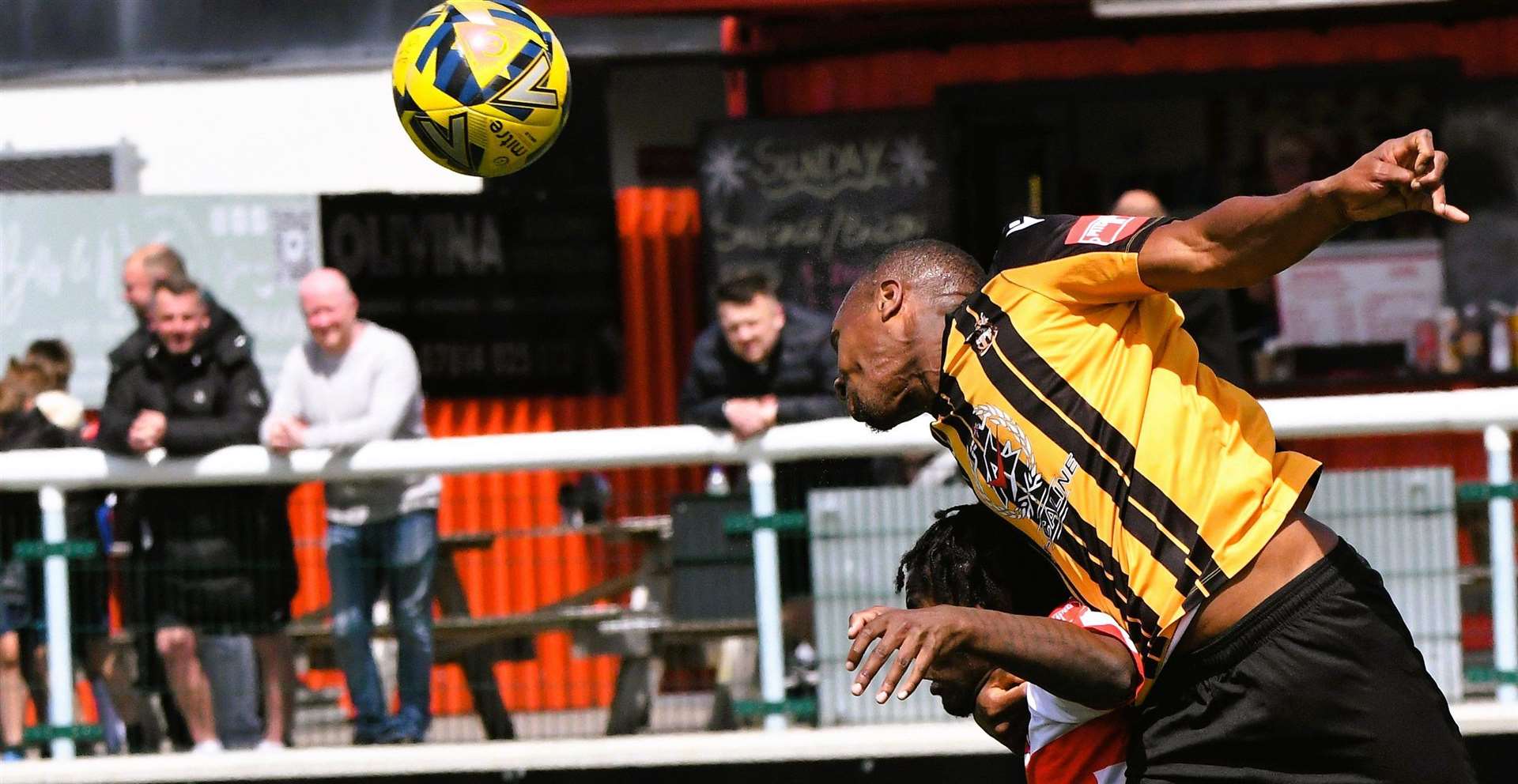 Folkestone's Gavin Hoyte heads the ball forward. Picture: Marc Richards