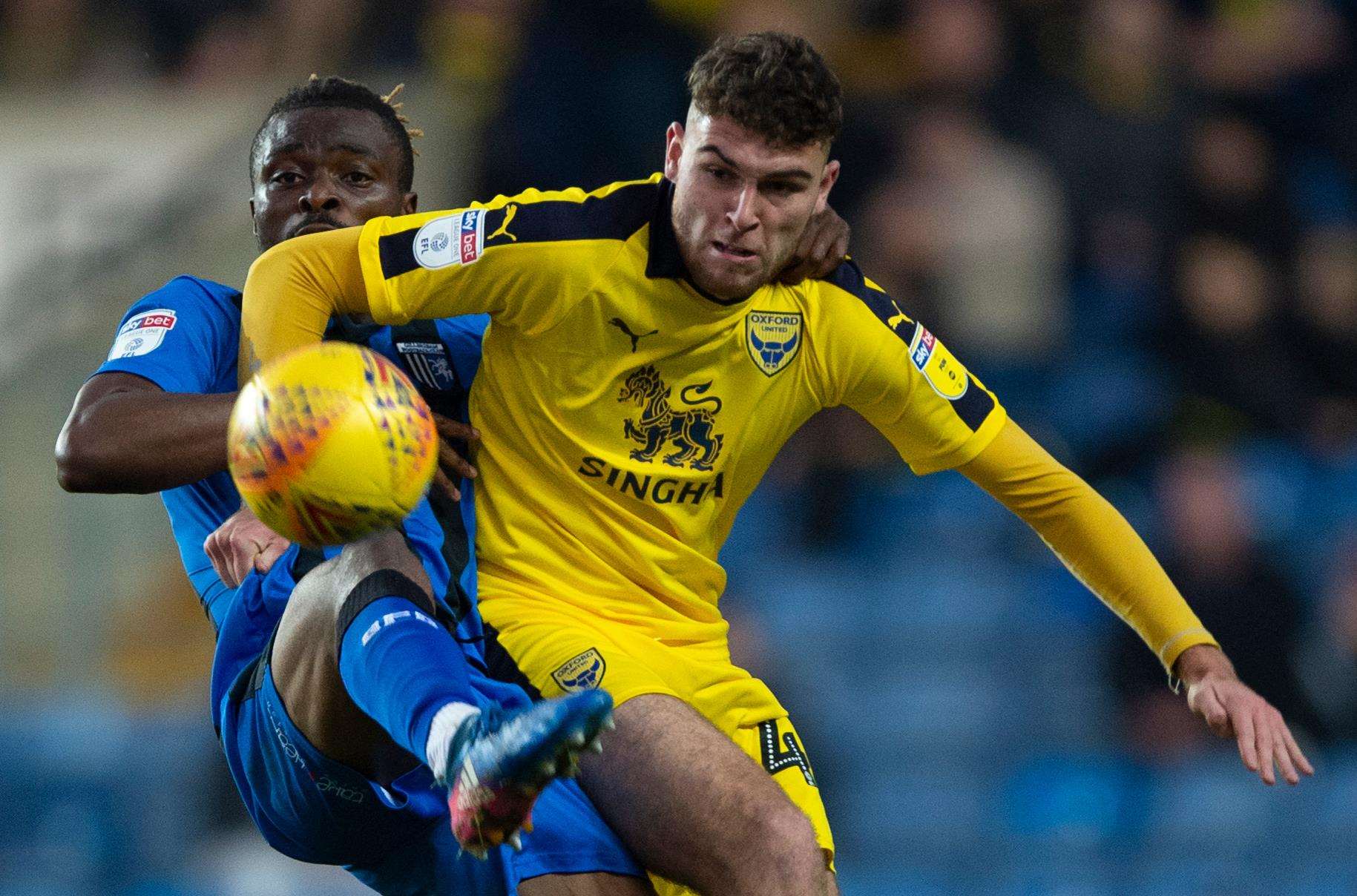 Gabriel Zakuani gets to the ball ahead of Harvey Bradbury Picture: Ady Kerry