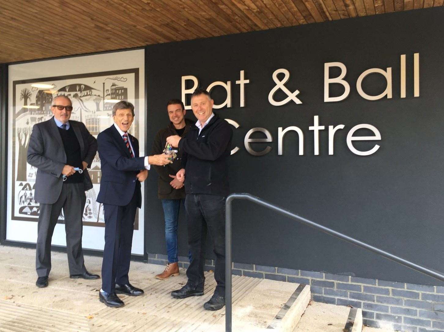 Cllr Richard Parry accepting the keys for the newly completed Bat and Ball Centre in 2021