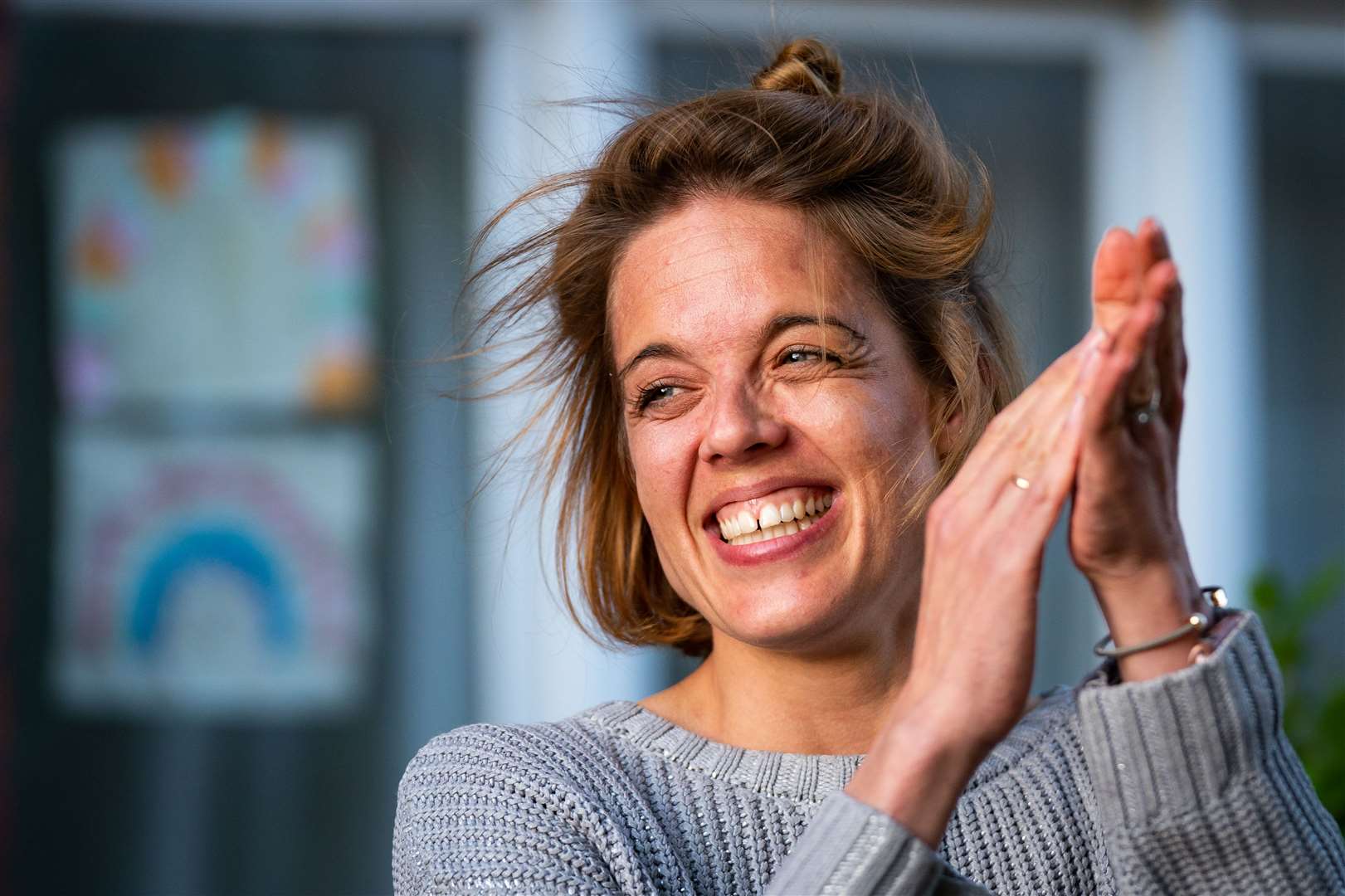 Annemarie Plas, 36, a Dutch national living in south London who created the 8pm Clap For Our Carers, stands with other residents in south London during the last weekly clap (Aaron Chown/PA).