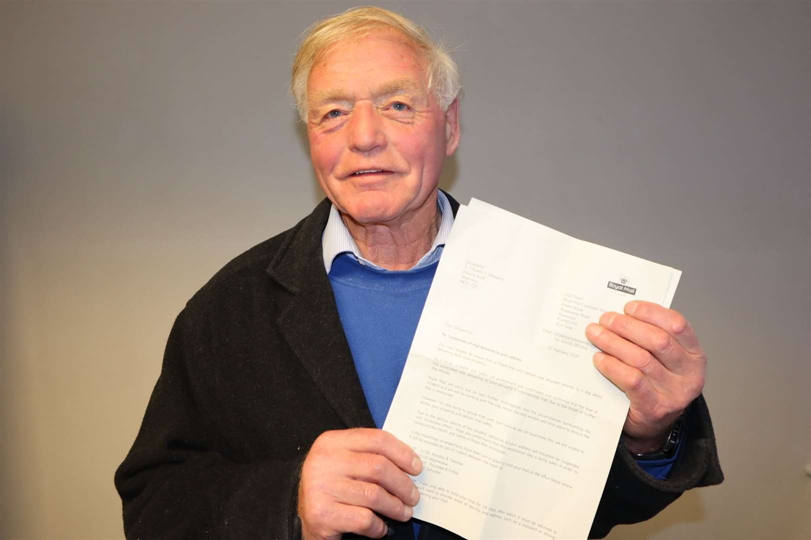 Butch Stanton with his letter from Royal Mail saying his postal service had been suspended