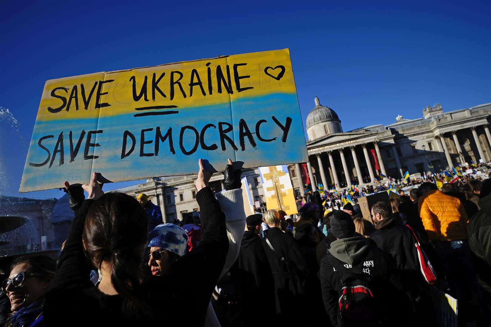 People take part in a demonstration in Trafalgar Square. (PA/Aaron Chown)