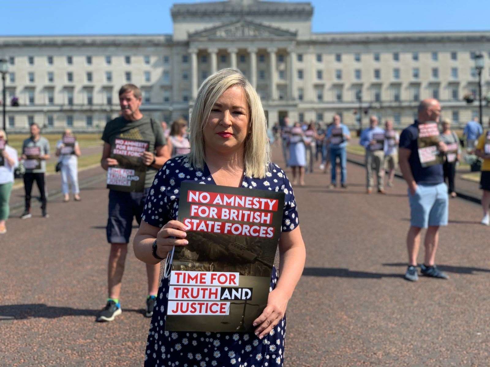 Sinn Fein deputy First Minister Michelle O’Neill with victims campaigners outside Parliament Buildings (Sinn Fein/PA)