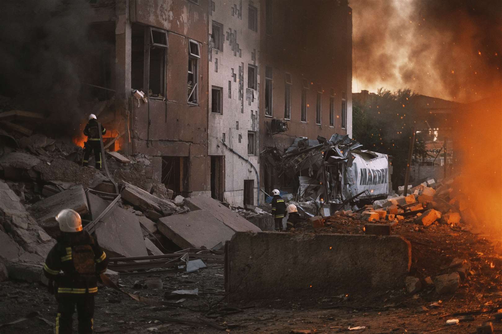 Firefighters work at the site of fire after Russian shelling in Mykolaiv, Ukraine, where Lesia Tsurenko is from (George Ivanchenko/AP/PA)