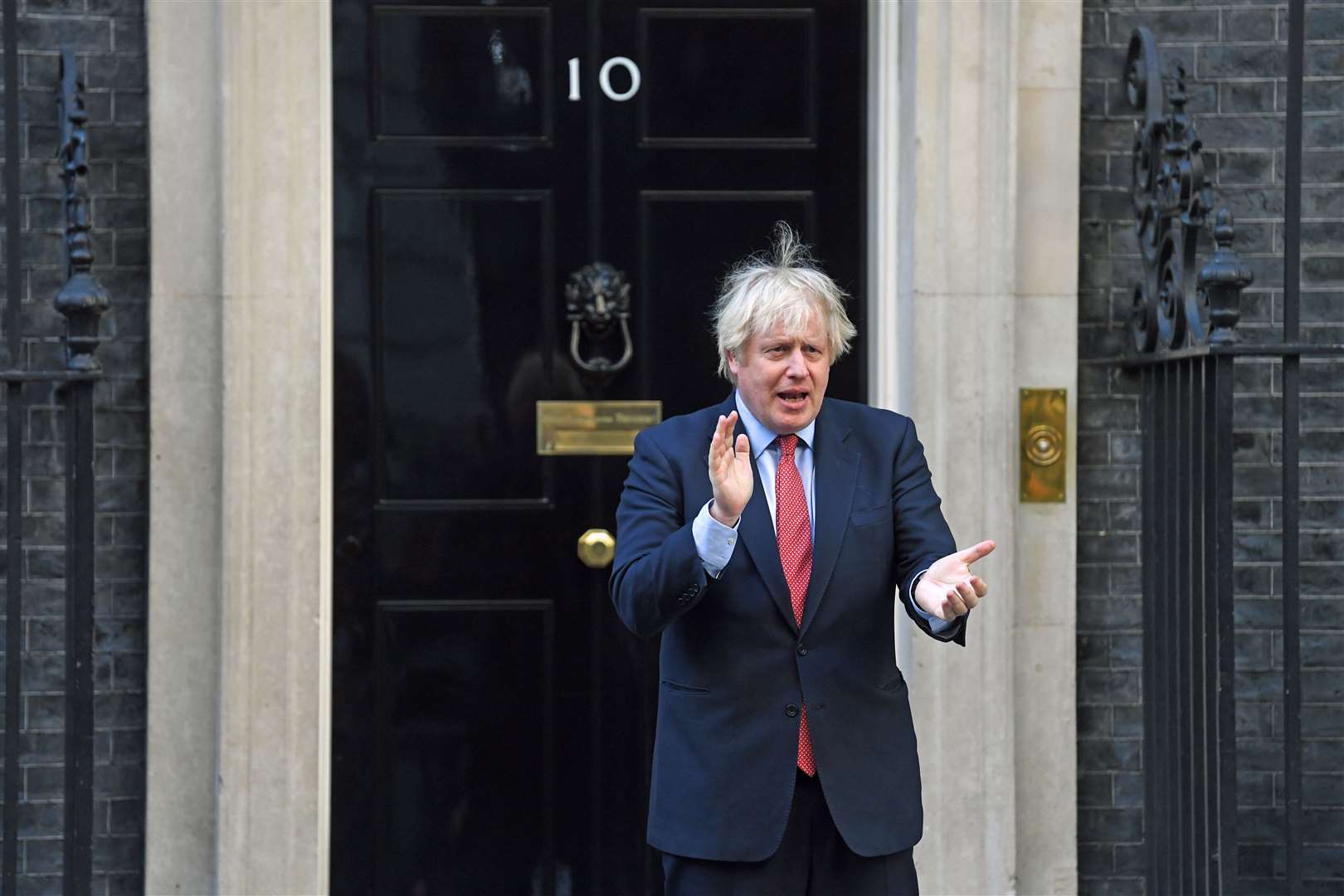 Prime Minister Boris Johnson applauds at 10 Downing Street (Kirsty O’Connor/PA)