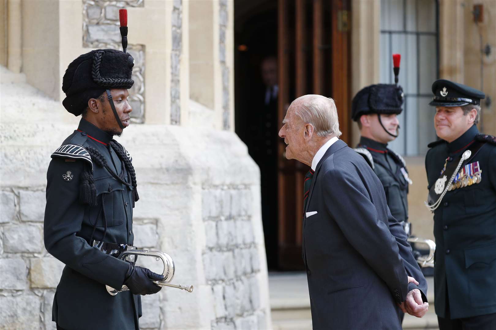 The Duke of Edinburgh speaks to a bugler at Windsor Castle (Adrian Dennis/PA)