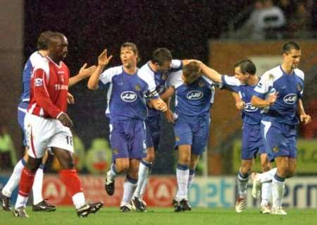 Jimmy Floyd Hasselbaink looks dejected as Wigan celebrate their third goal. Picture: MATT WALKER