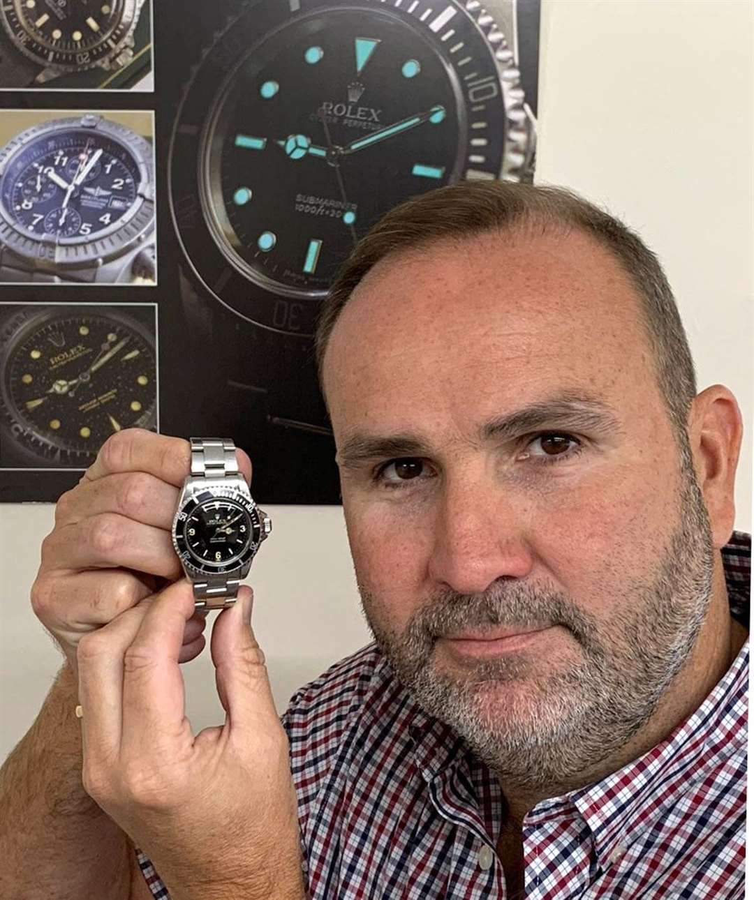 Auctioneer David Hare with the former miner’s Rolex watch (Gardiner Houlgate/PA)