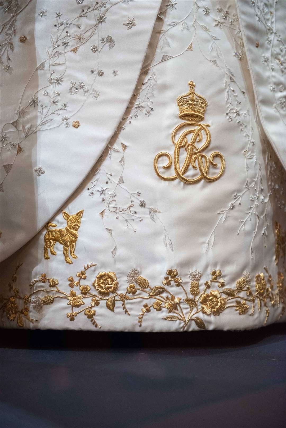 One of the dog motifs on the Queen’s coronation dress and the name of one her grandsons, Gus (Royal Collection Trust/HM King Charles III/PA)