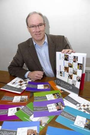 Philip Wicker, chairman of the Canterbury Partnership 14-19, with the diploma paper work