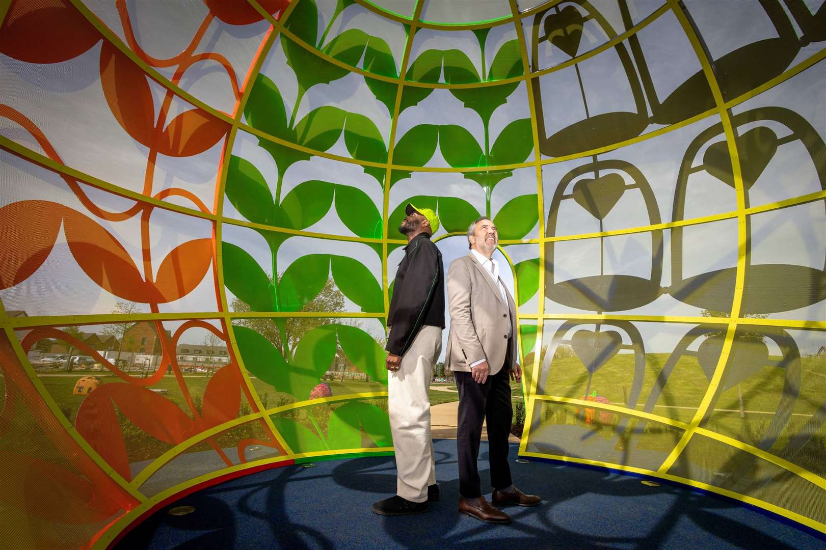 Yinka Ilori and Andrew Blevins inside the five metre high installation