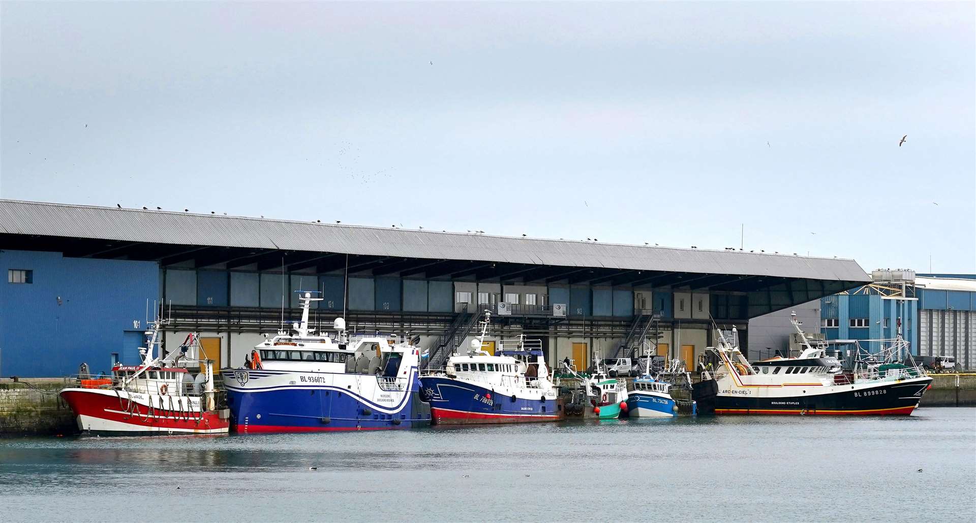 Fishing boats moored in the port of Boulogne, France (Gareth Fuller/PA)