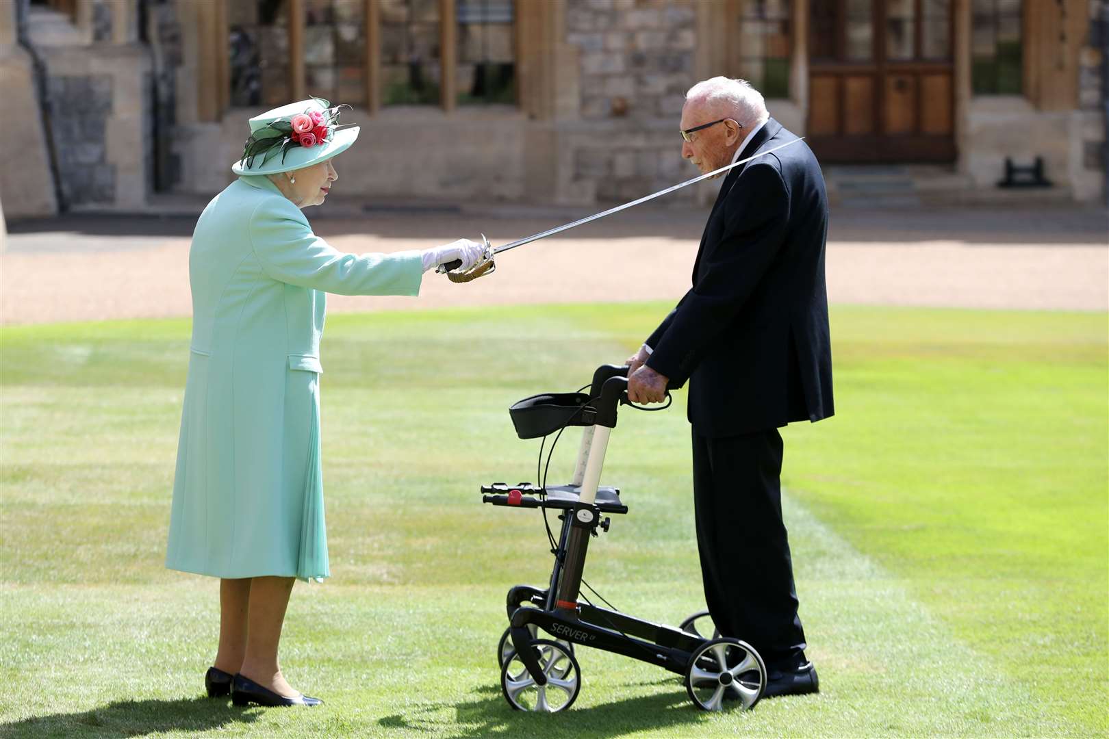 He became Captain Sir Tom Moore when he was knighted by the Queen (Chris Jackson/PA)