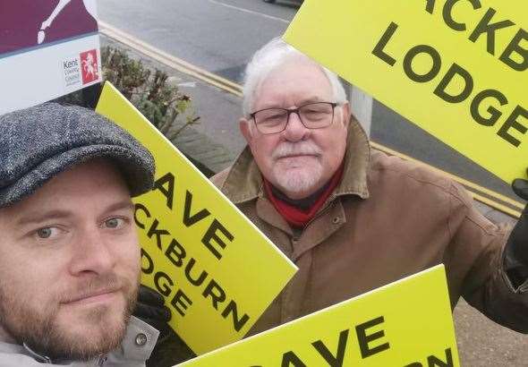 David Sawyer and his son Liam protesting