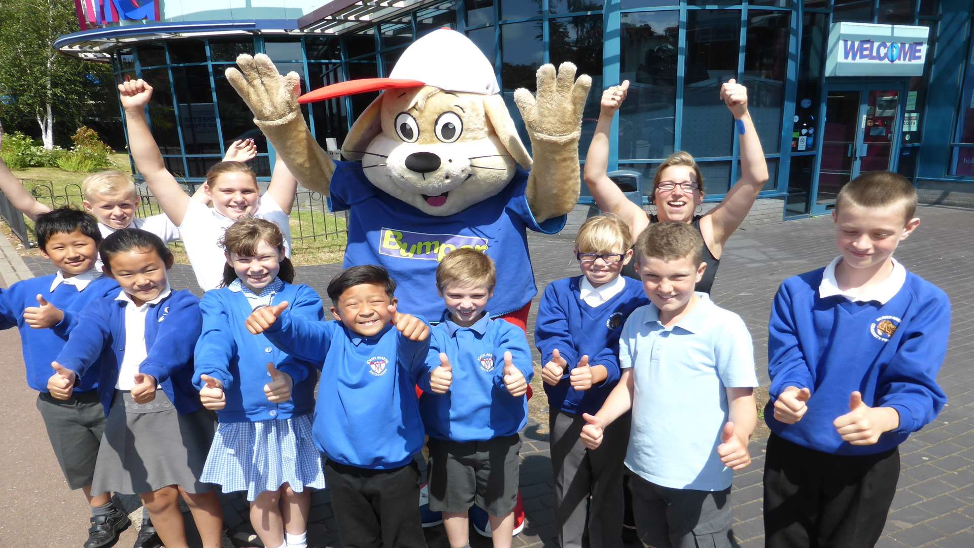 Tracy Wratten of AMF Bowling and mascot Bumper with the winners of the Ashford district walk to school challenge.