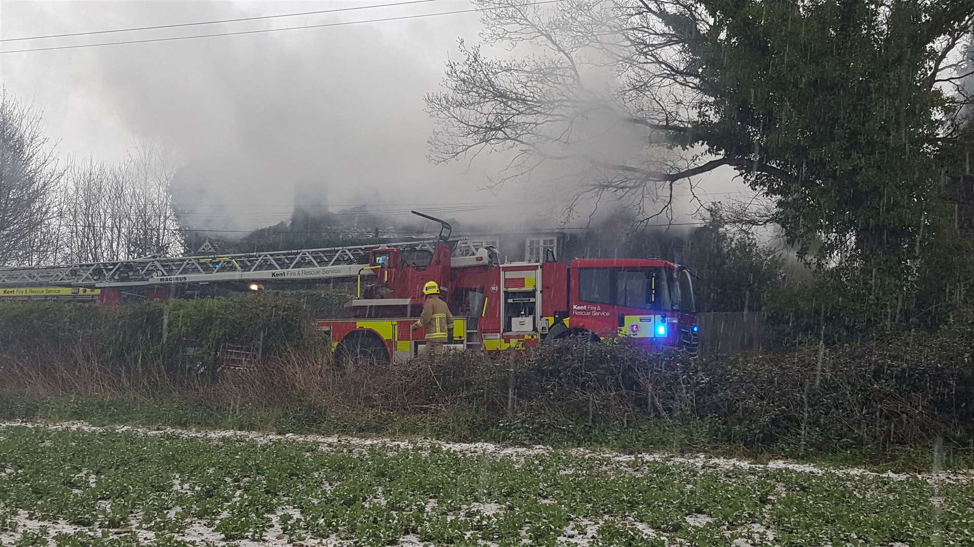 Water from two main jets and a hydrant are being used to fight the flames