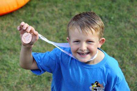 Kidney Transplant recipient George Penhaligan with his medal.