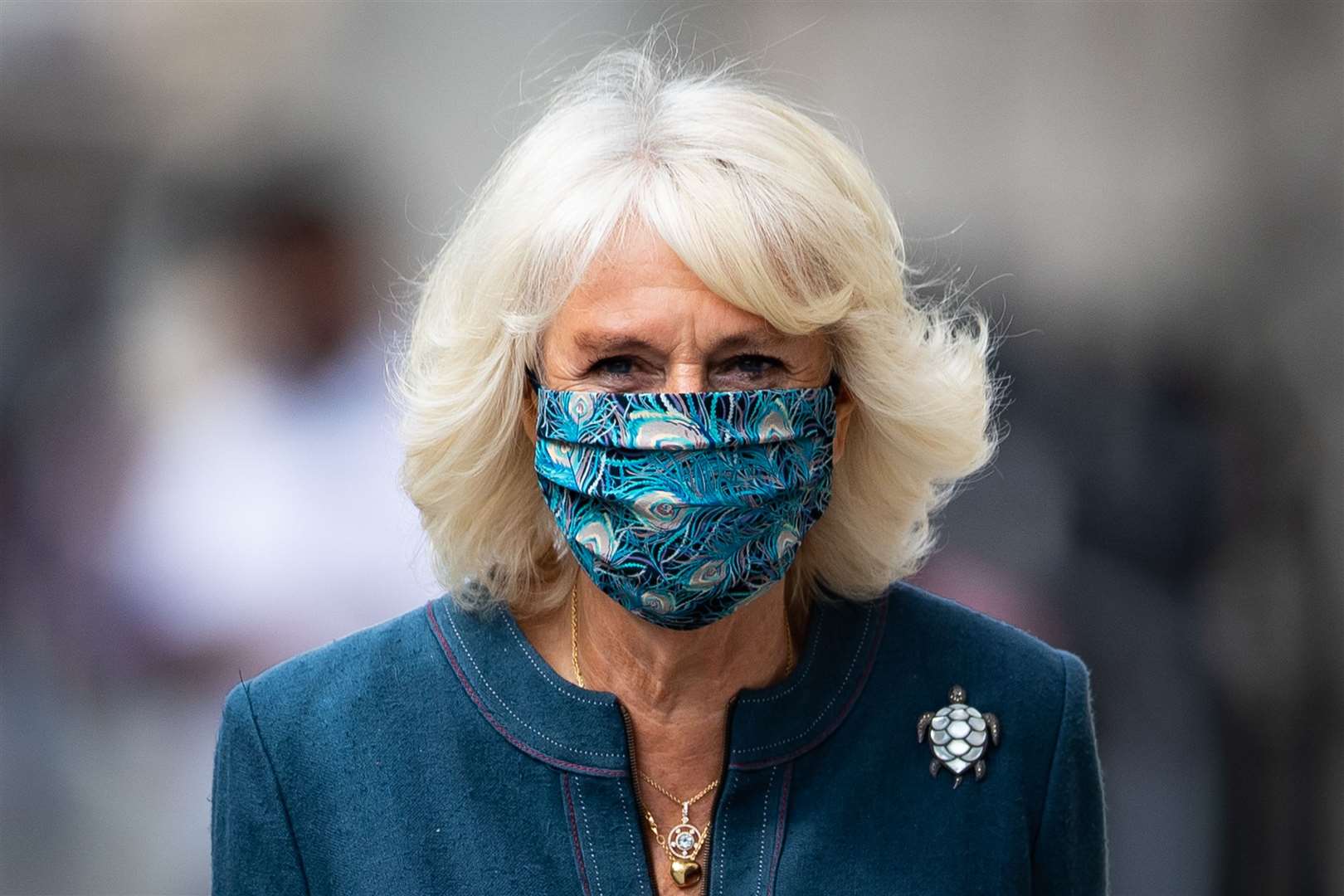 Camilla in her peacock-patterned Liberty print mask (Aaron Chown/PA)