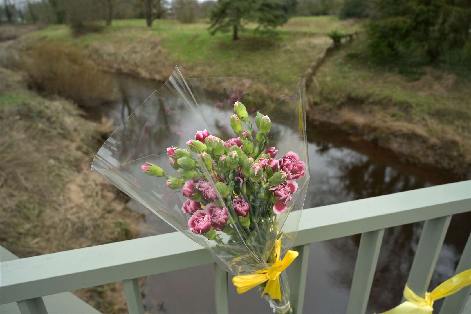 Flowers, and ribbons on a bridge over the River Wyre in St Michael’s (Dave Nelson/PA)