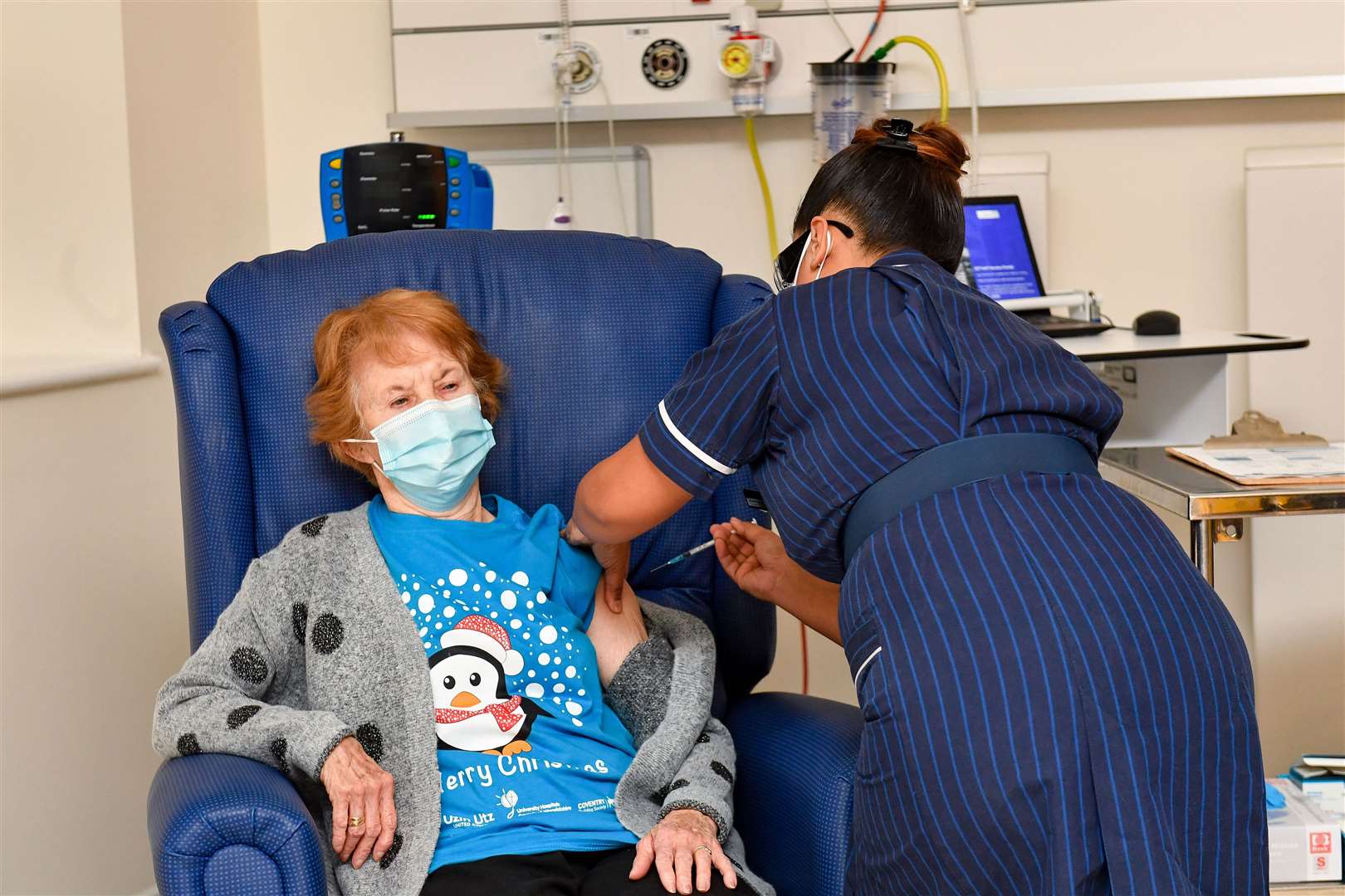 Margaret Keenan, 90,became the first person in the UK to receive the Pfizer/BioNtech covid-19 vaccine at University Hospital, Coventry (Jacob King/PA)