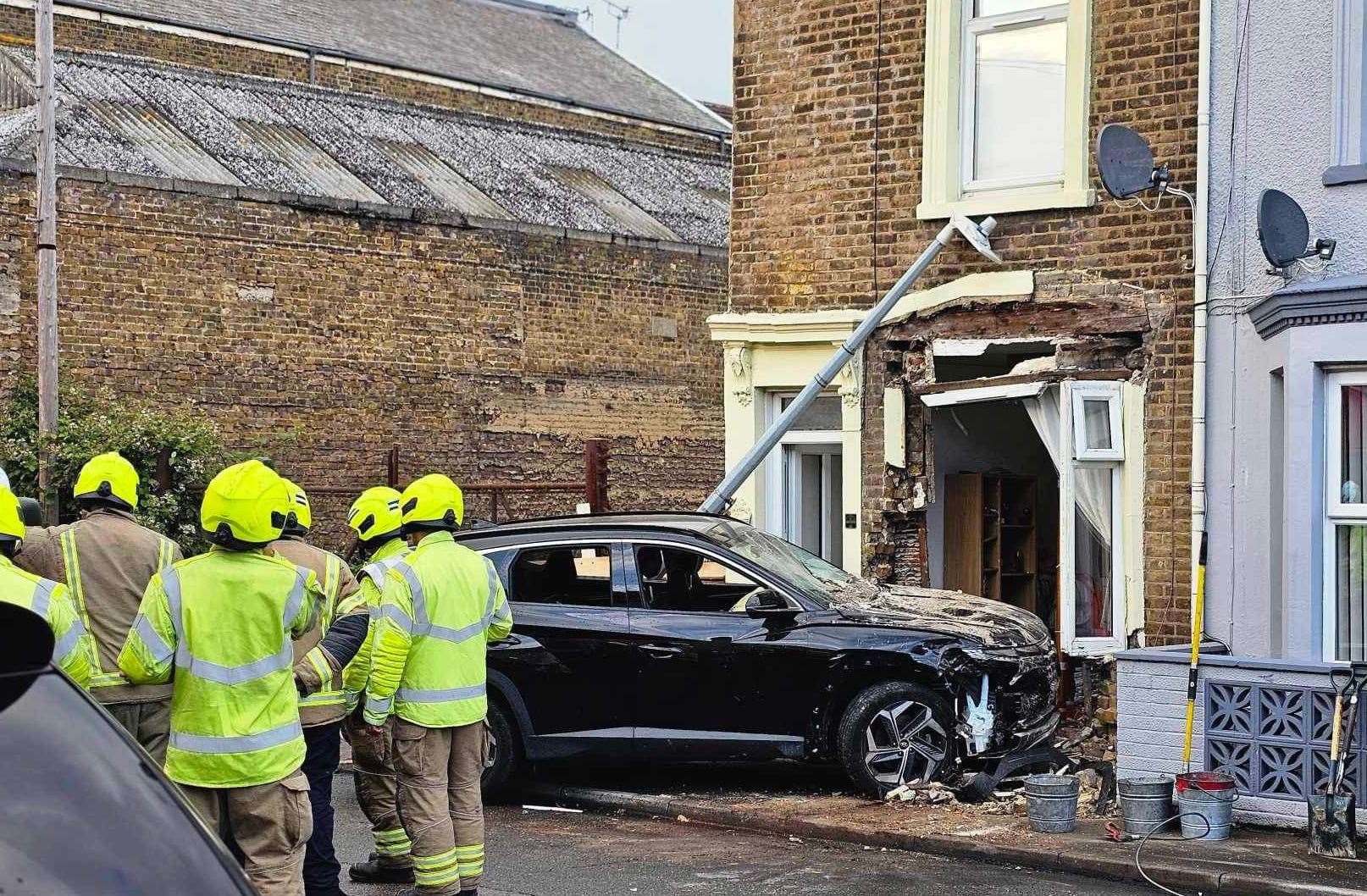 The black car crashed into the two-storey home on Sheerness Broad Street, Sheerness. Photo: Laura Nina