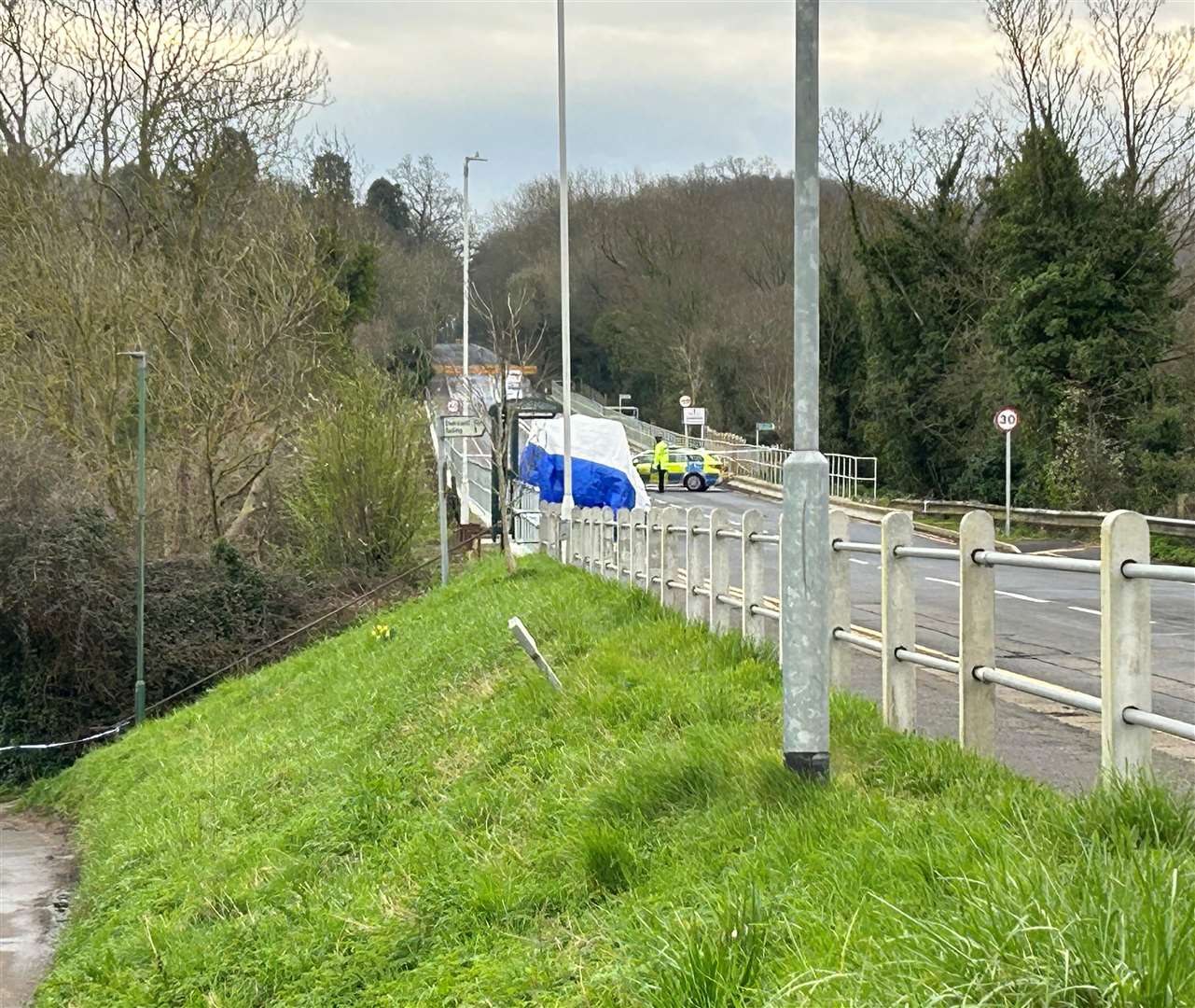 A white tent was erected near a bus stop in the village following the stabbing in March