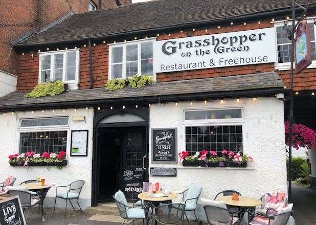 The flowers in the containers on the windowsills were certainly colourful, but the hanging baskets, at both sides of the pub, were a real picture