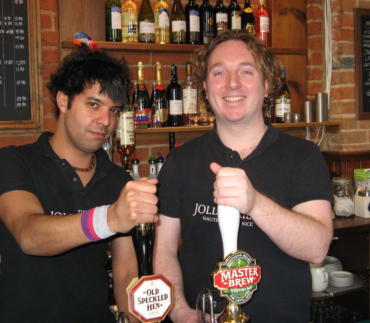 Omar Sockni and Ian Blackmore pull a pint for customers at the Jolly Sailor back in 2008