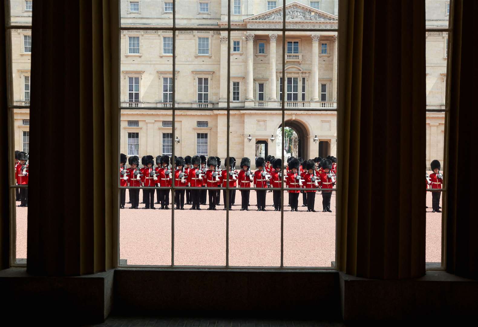 Foot Guards of the Household Division line up at Buckingham Palace (Suzanne Plunkett/PA)