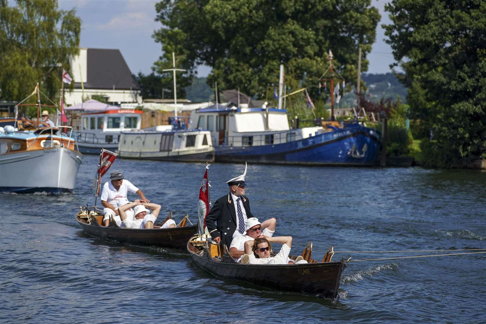 Swan Uppers take a break from rowing near Bourne End, Berkshire (Steve Parsons/PA)