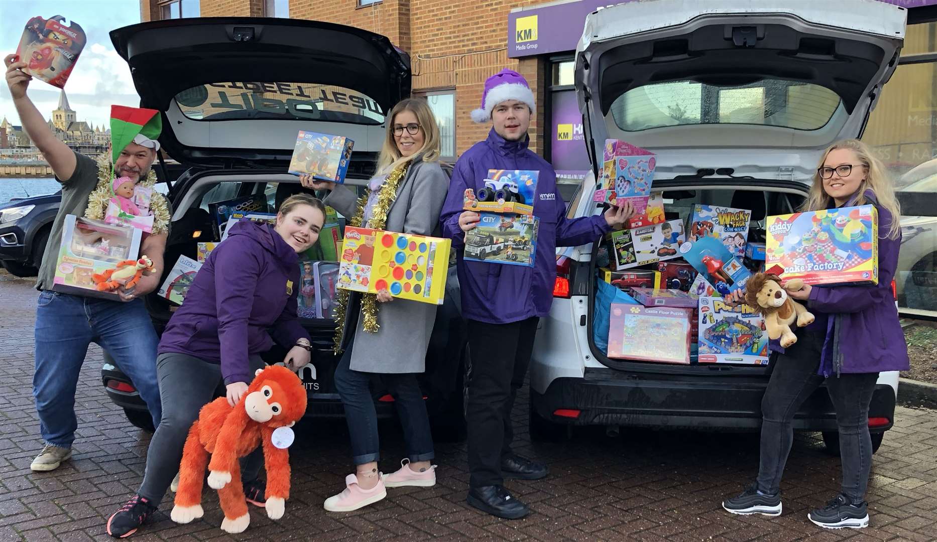 The kmfm Street Team and breakfast show presenters Garry and Laura get ready to deliver toys last Christmas