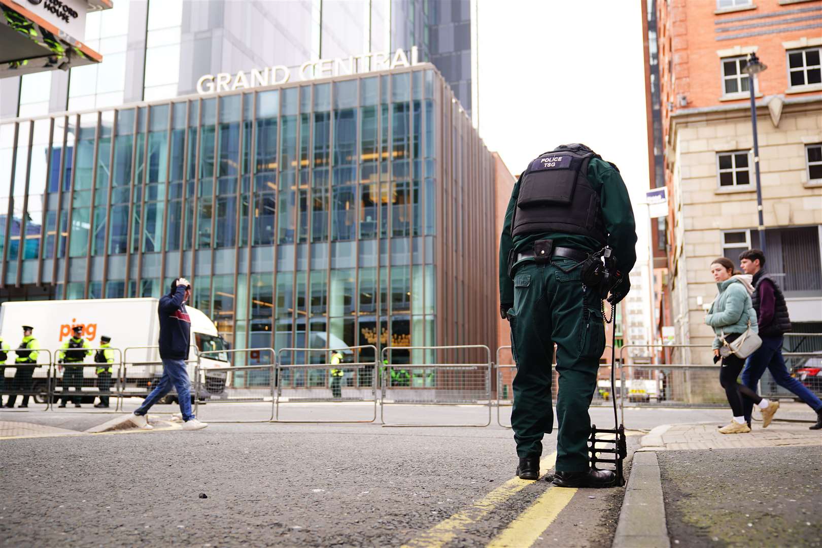 A police officer inspects a drain in Belfast as part of the security operation already under way ahead of the visit of US President Joe Biden (Aaron Chown/PA)