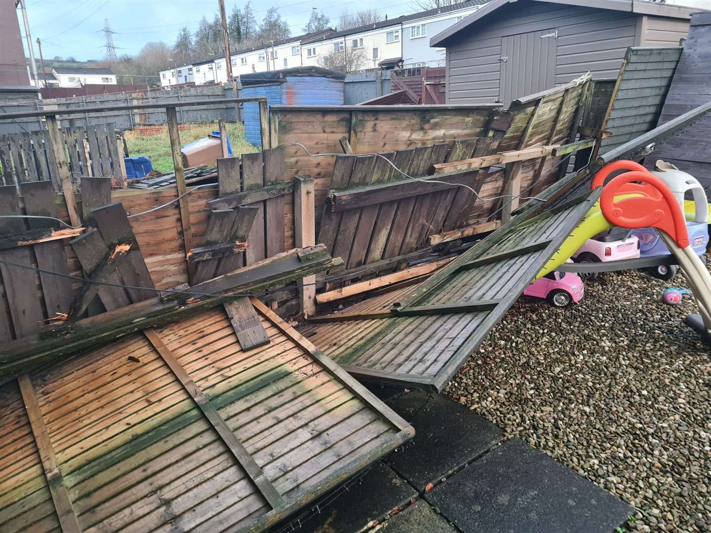 Damage caused by Storm Darragh in the back garden of a house in the Lenadoon area of west Belfast (PA)