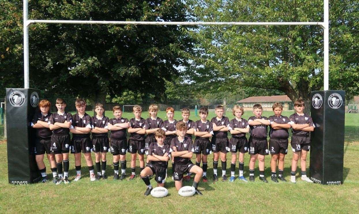 The U12s team posed under the same posts for their team photo this season