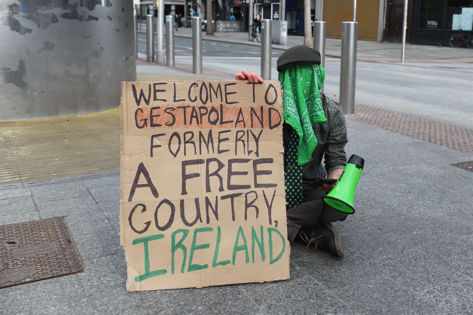 A lone demonstrator on O’Connell Street in Dublin city centre (Brian Lawless/PA)