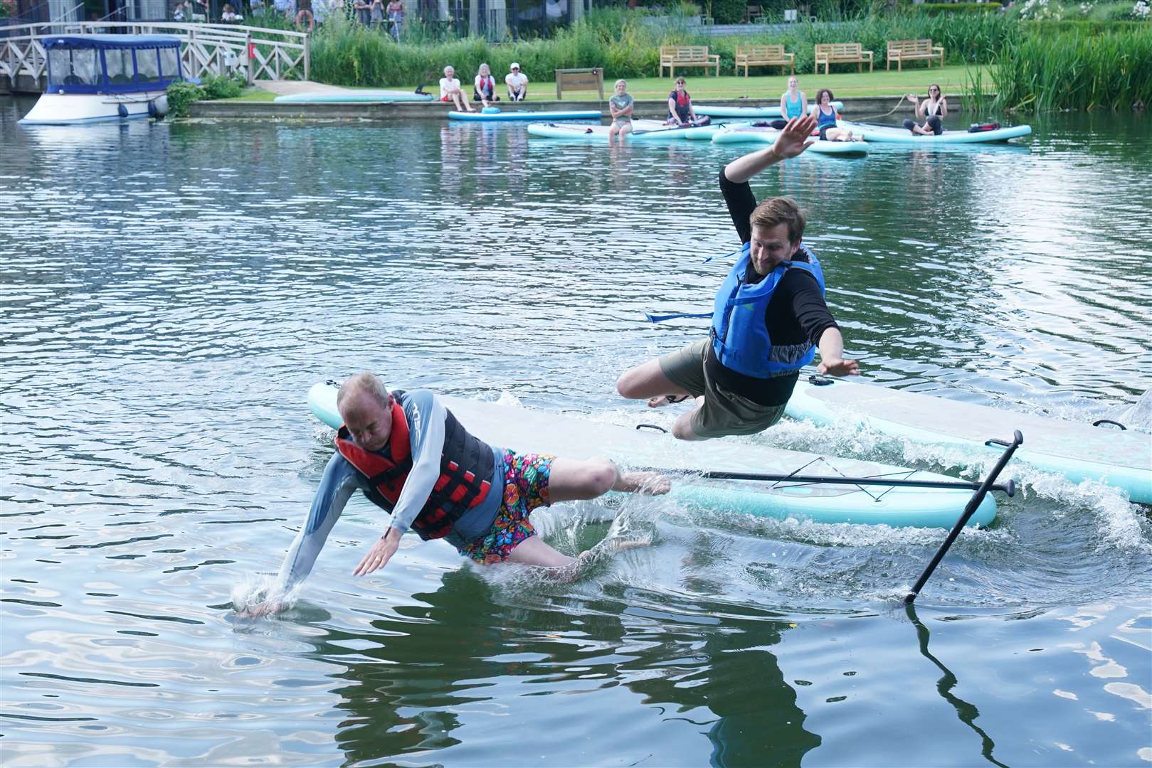 Sir Ed Davey falls off a paddleboard during his visit to Streatley, Berkshire (Jonathan Brady/PA)