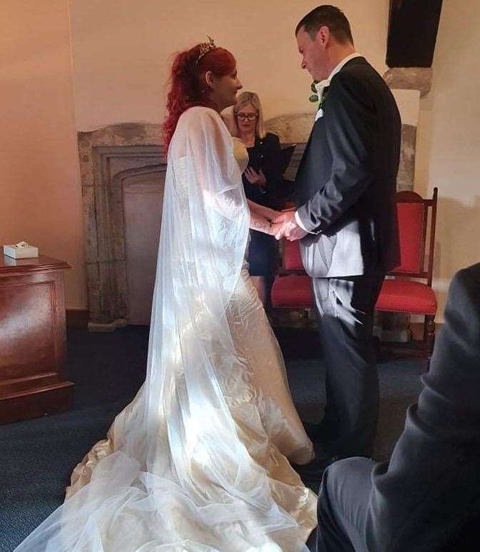 Amy was able to stand at the aisle to marry Ben, using a stool to support her right leg, part of which was amputated