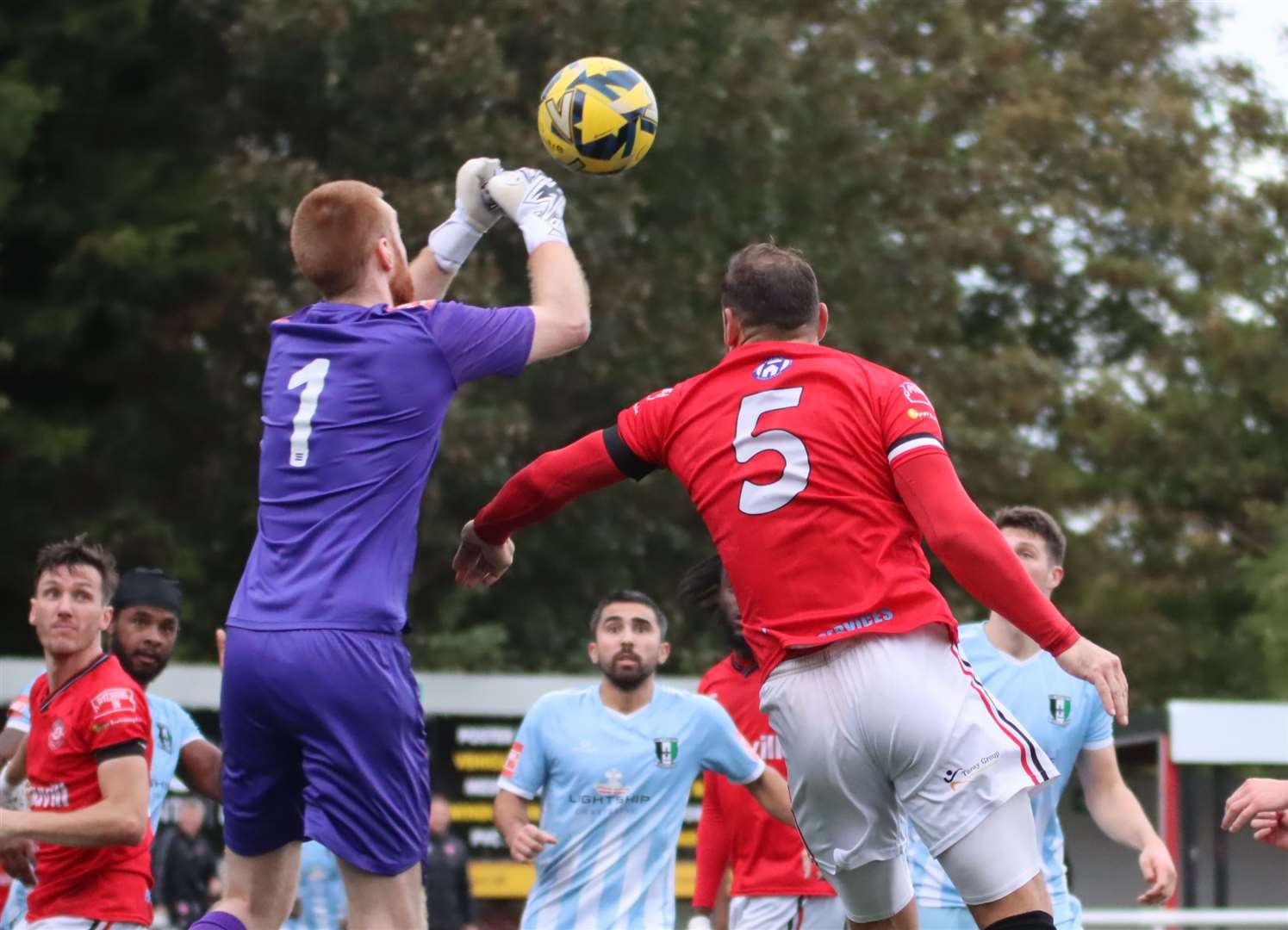 Away goalkeeper Max Ovenden beats Chatham defender Reece Butler to the ball. Picture: Max English @max_ePhotos