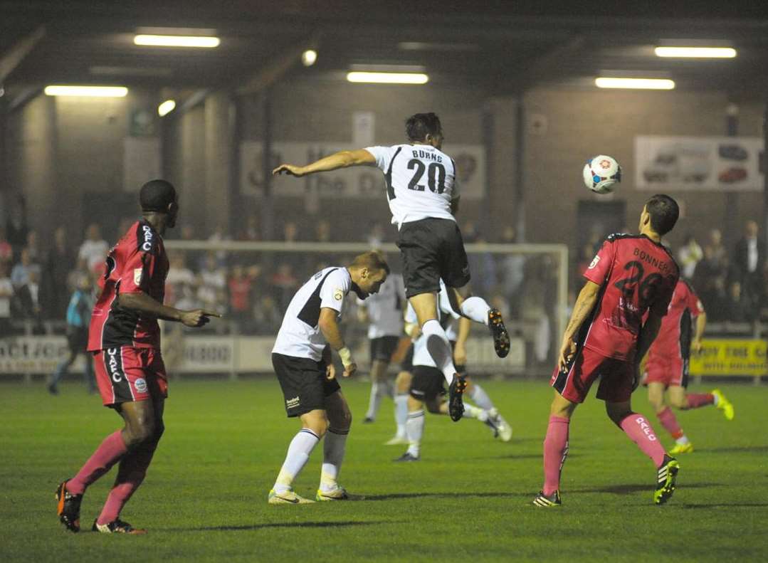 Lee Burns gets up well for Dartford in the Kent derby against Dover Picture: Steve Crispe