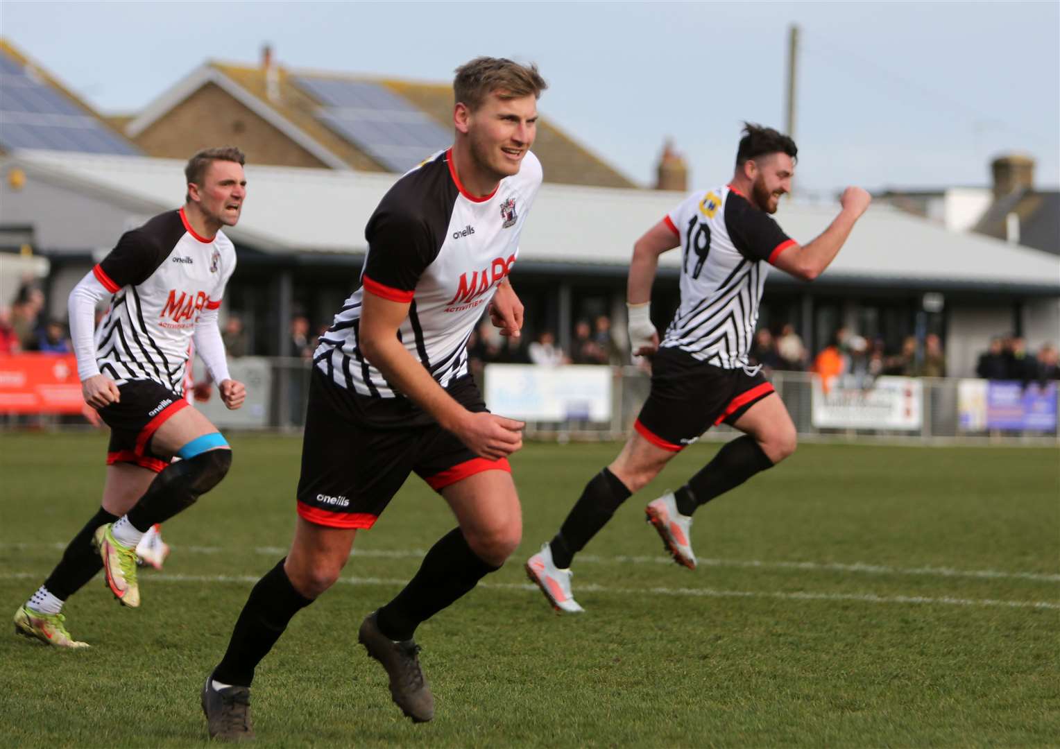 Connor Coyne, No.19, celebrates Deal's winning goal with Tom Chapman and Kane Smith. Picture: Paul Willmott