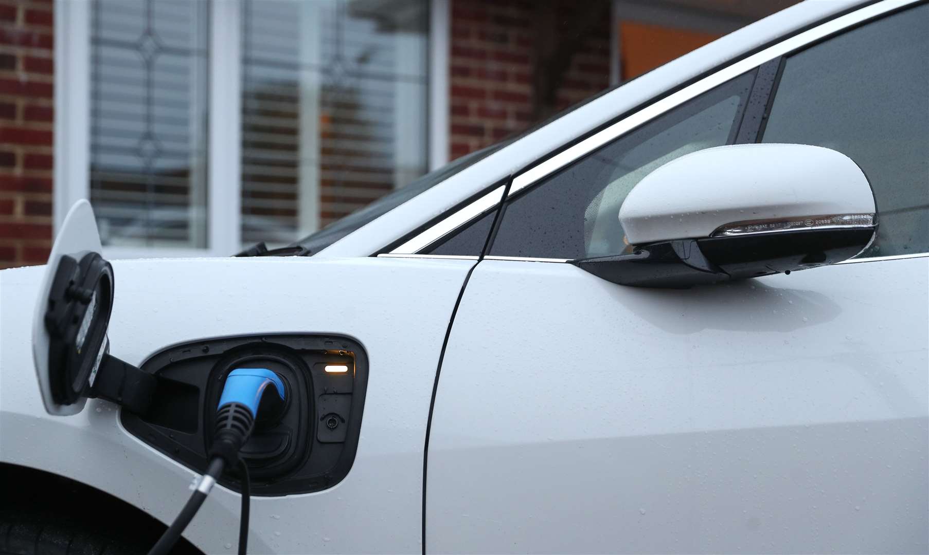 Tax incentives are needed to encourage faster take-up of electric cars, the report found (Andrew Matthews/PA)