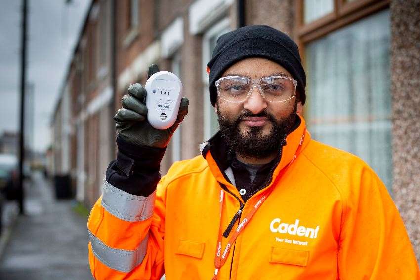 Mo Dawood with a CO alarm. (Cadent/PA)