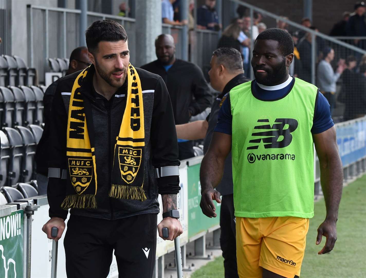 Joan Luque leaves Dartford on crutches after suffering his knee injury. Picture: Steve Terrell