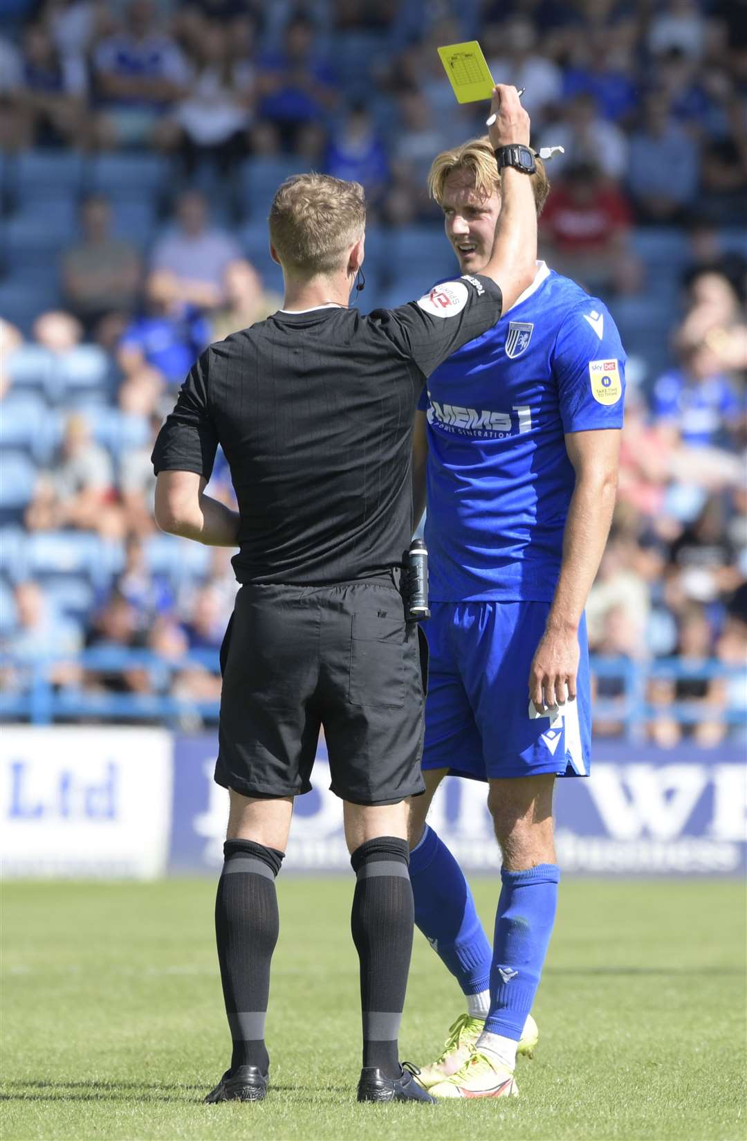 Will Wright is booked by referee Will Finnie. Picture: Barry Goodwin