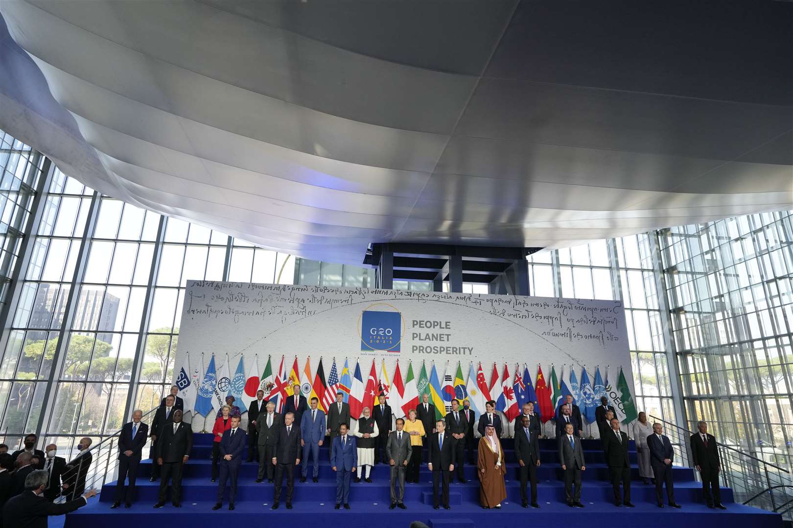 World leaders pose for a group photo at the La Nuvola conference centre during the G20 summit in Rome (Kirsty Wigglesworth/PA)